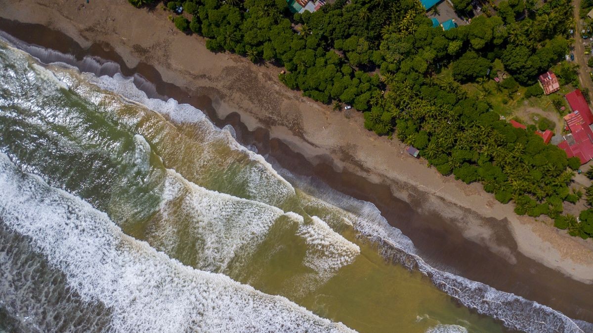 Beautiful aerial view of the ocean, beach and mountains of Costa Rica , Dominical